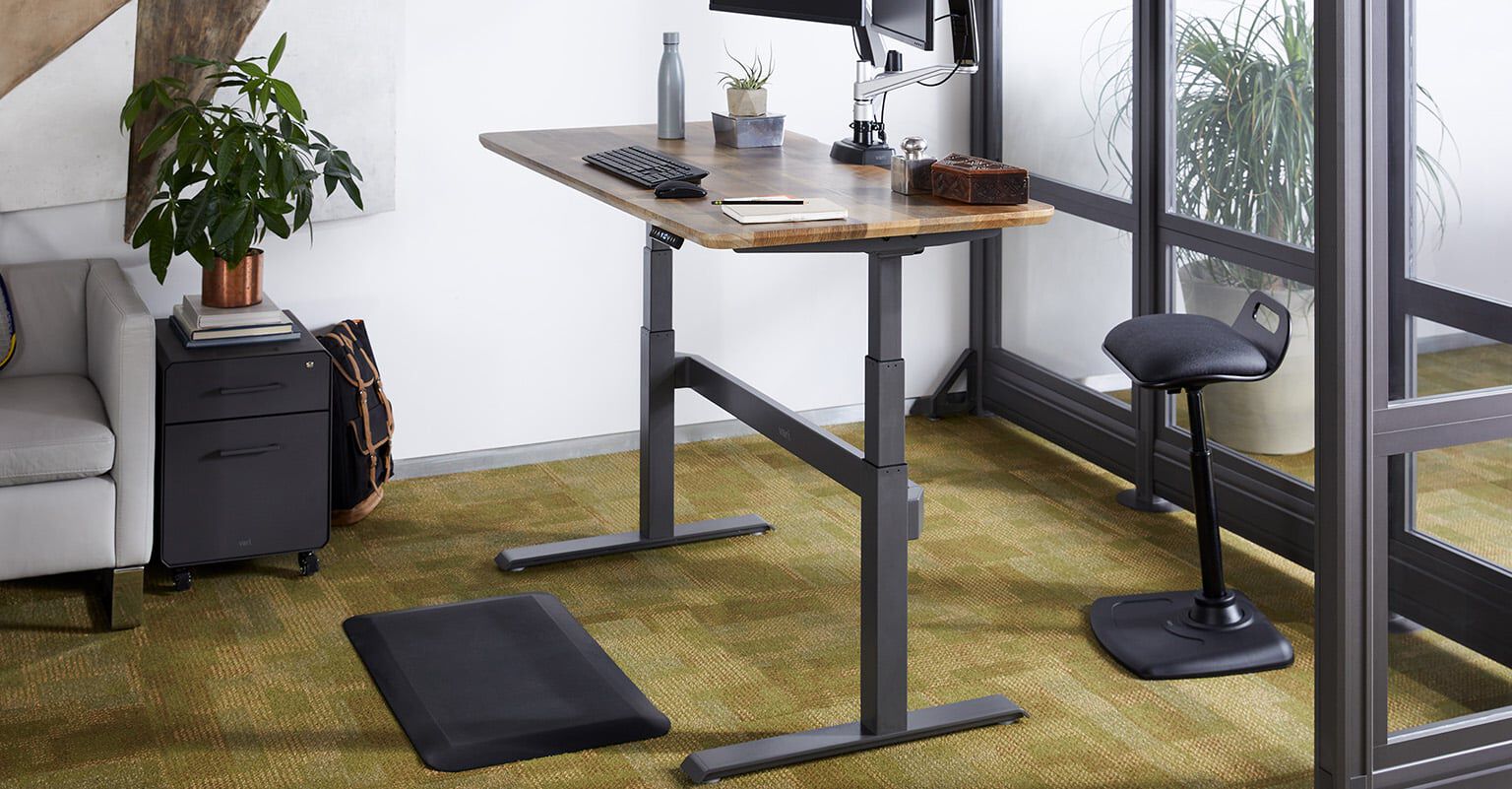 vari electric standing desk in a workspace setting